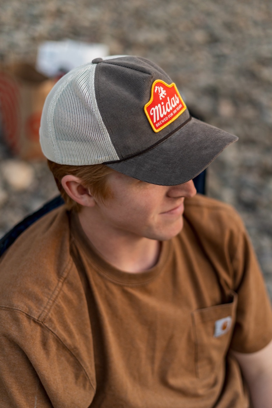 Close-up of a Midas patch on a corduroy trucker cap