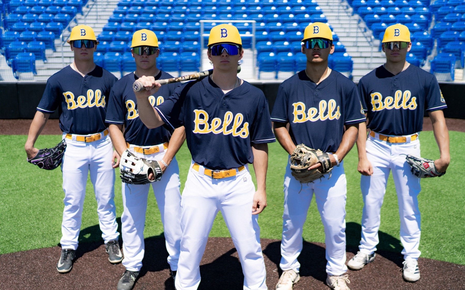 Five Bellingham Bells players lined up on the infield